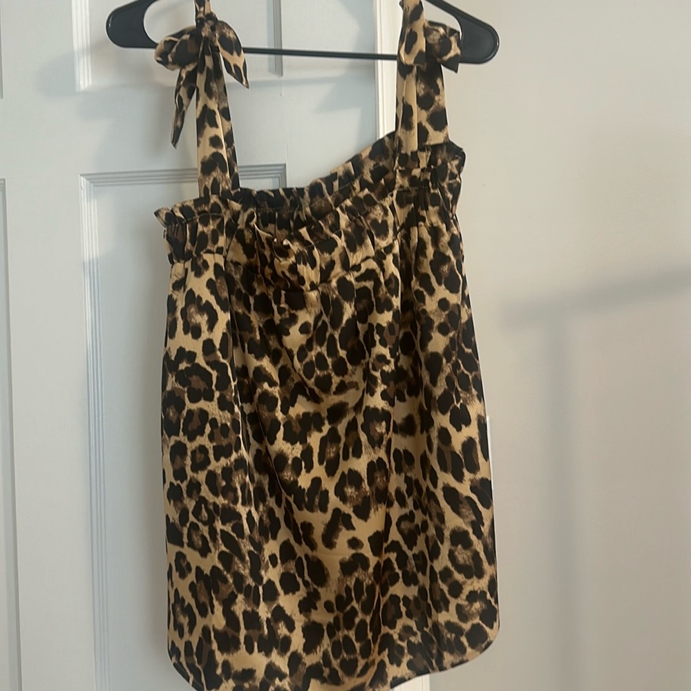 Pink lily adjustable strap cheetah print tank top. Size small